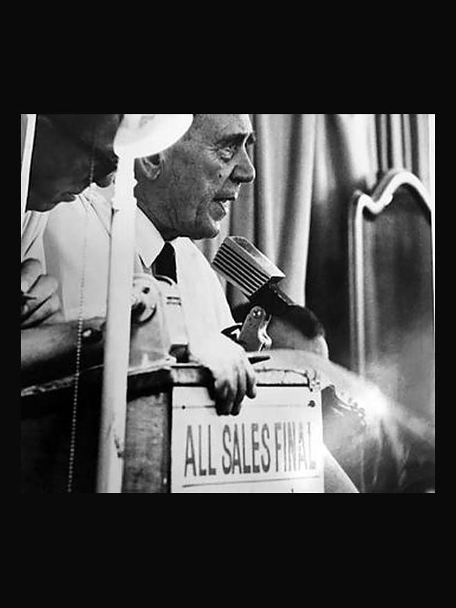 Abraham N. Abell taking bids from the rostrum, an ALL SALES FINAL sign in front of him