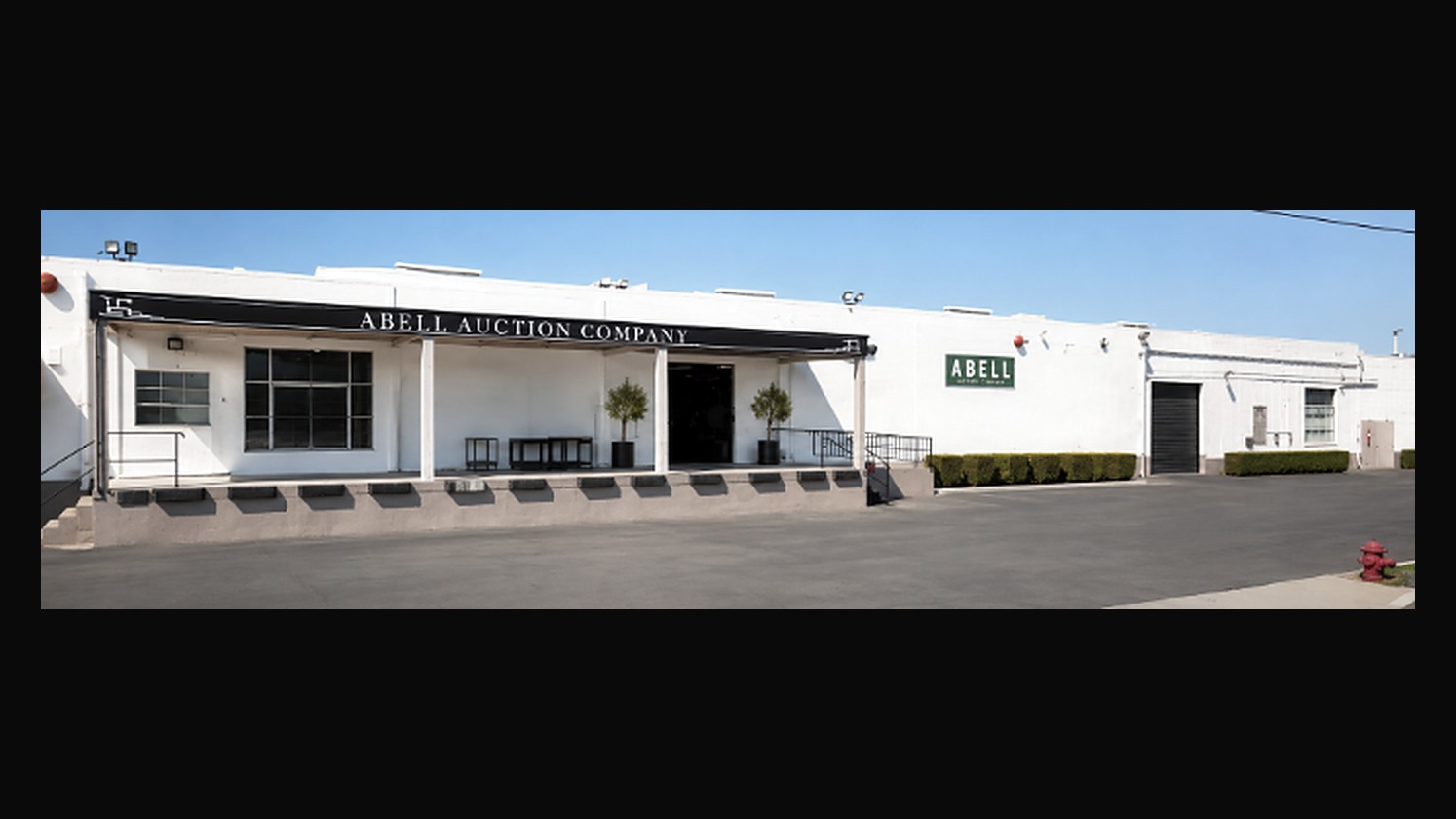 The Abell Auction Company gallery in Commerce, its name lettered across the portico