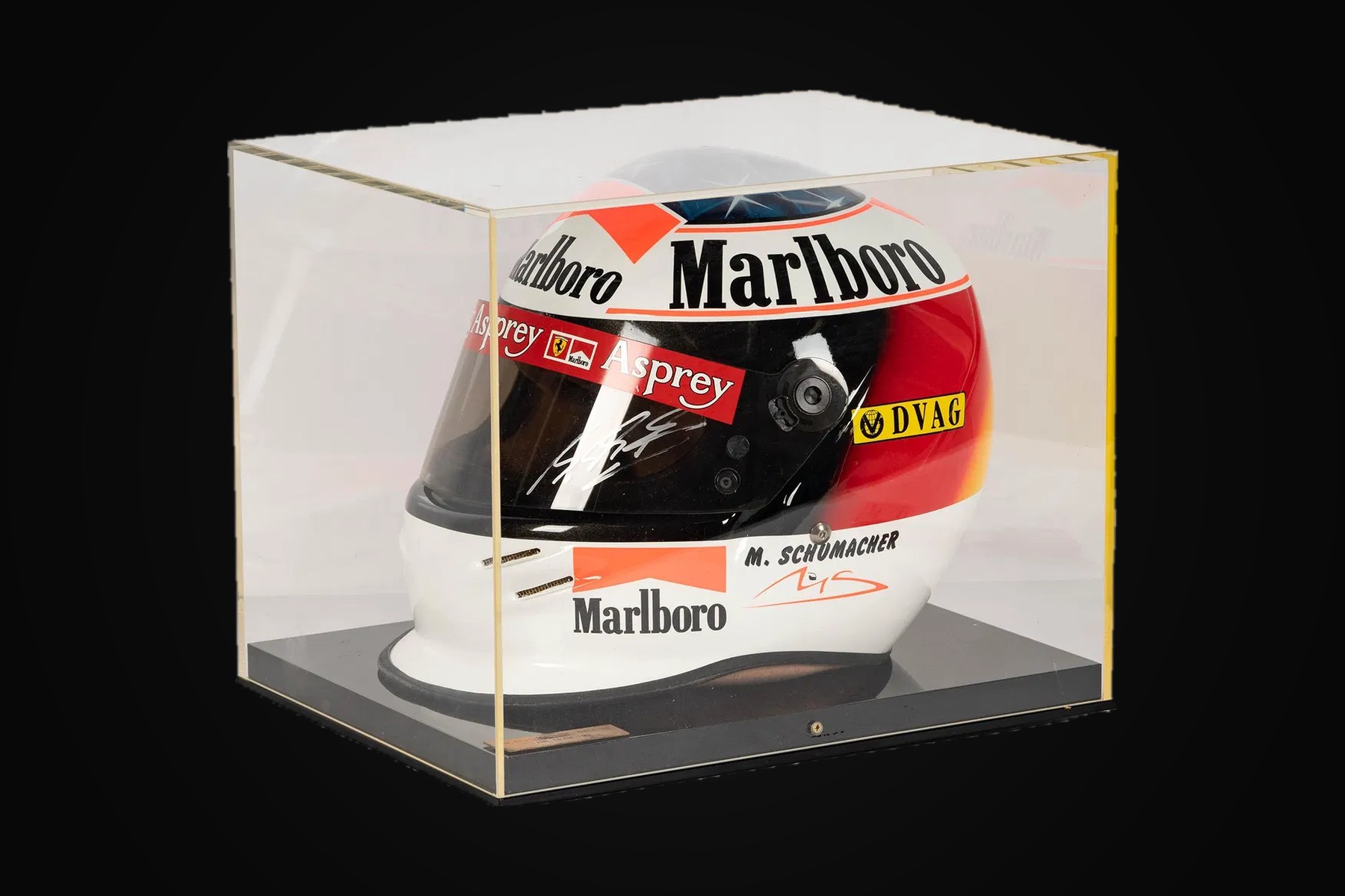 A signed Formula One racing helmet in its display case