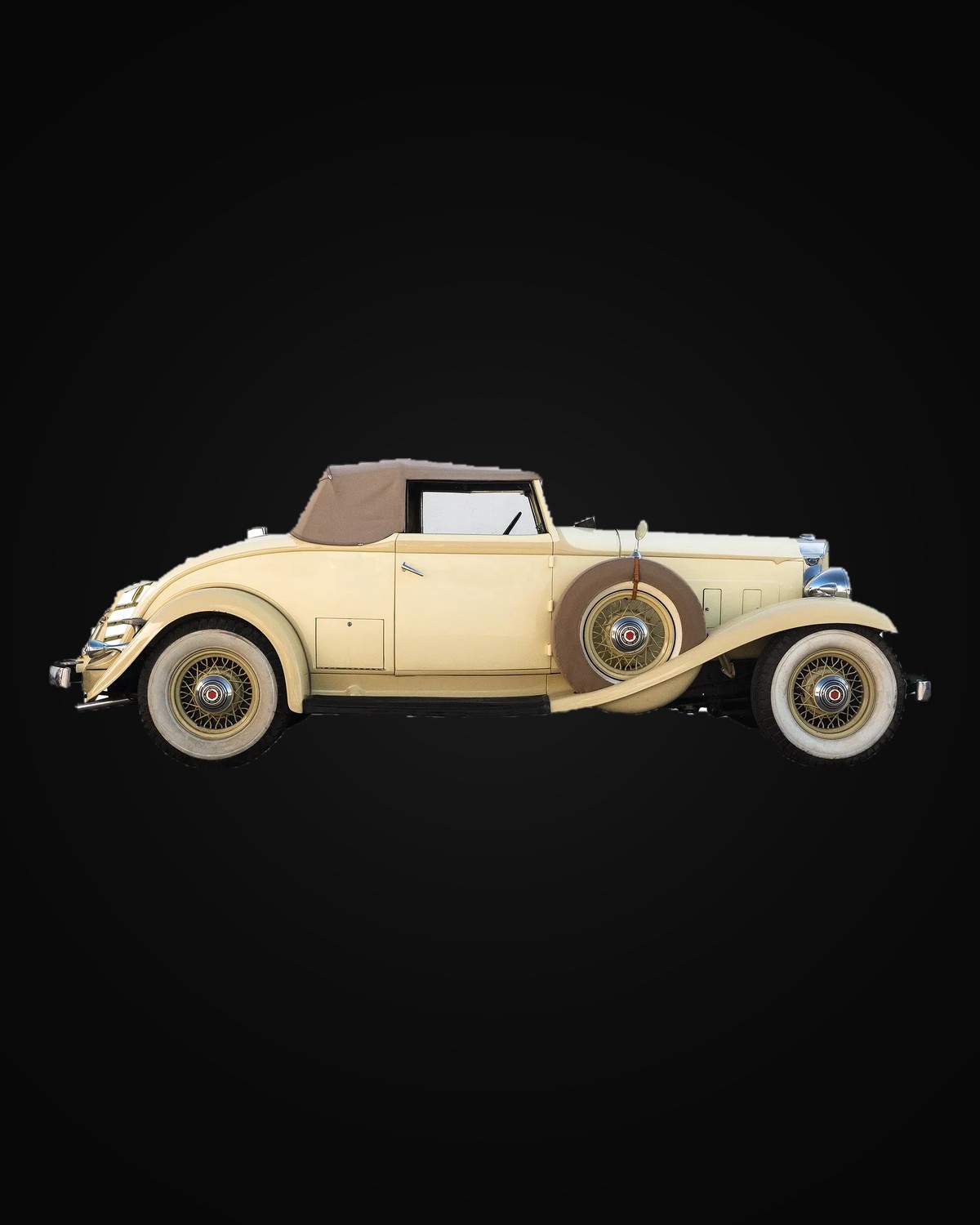 A cream Packard convertible coupe in profile