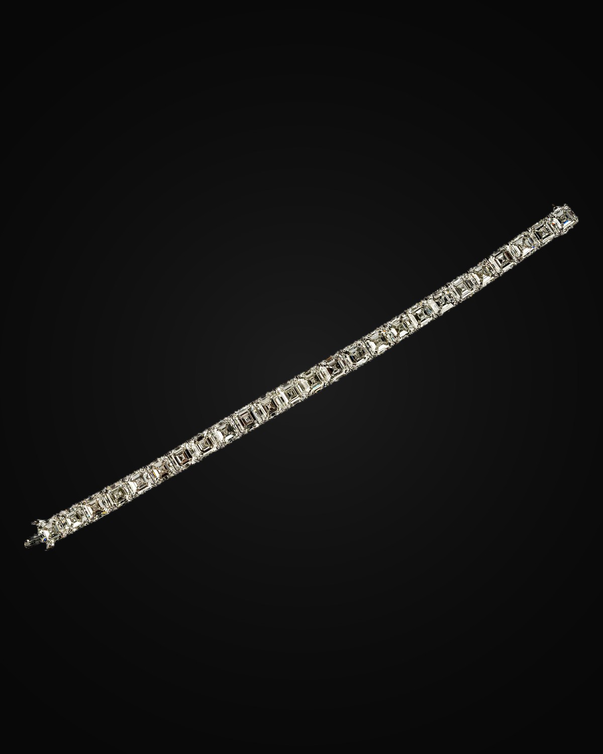 A platinum line bracelet set with square-cut diamonds