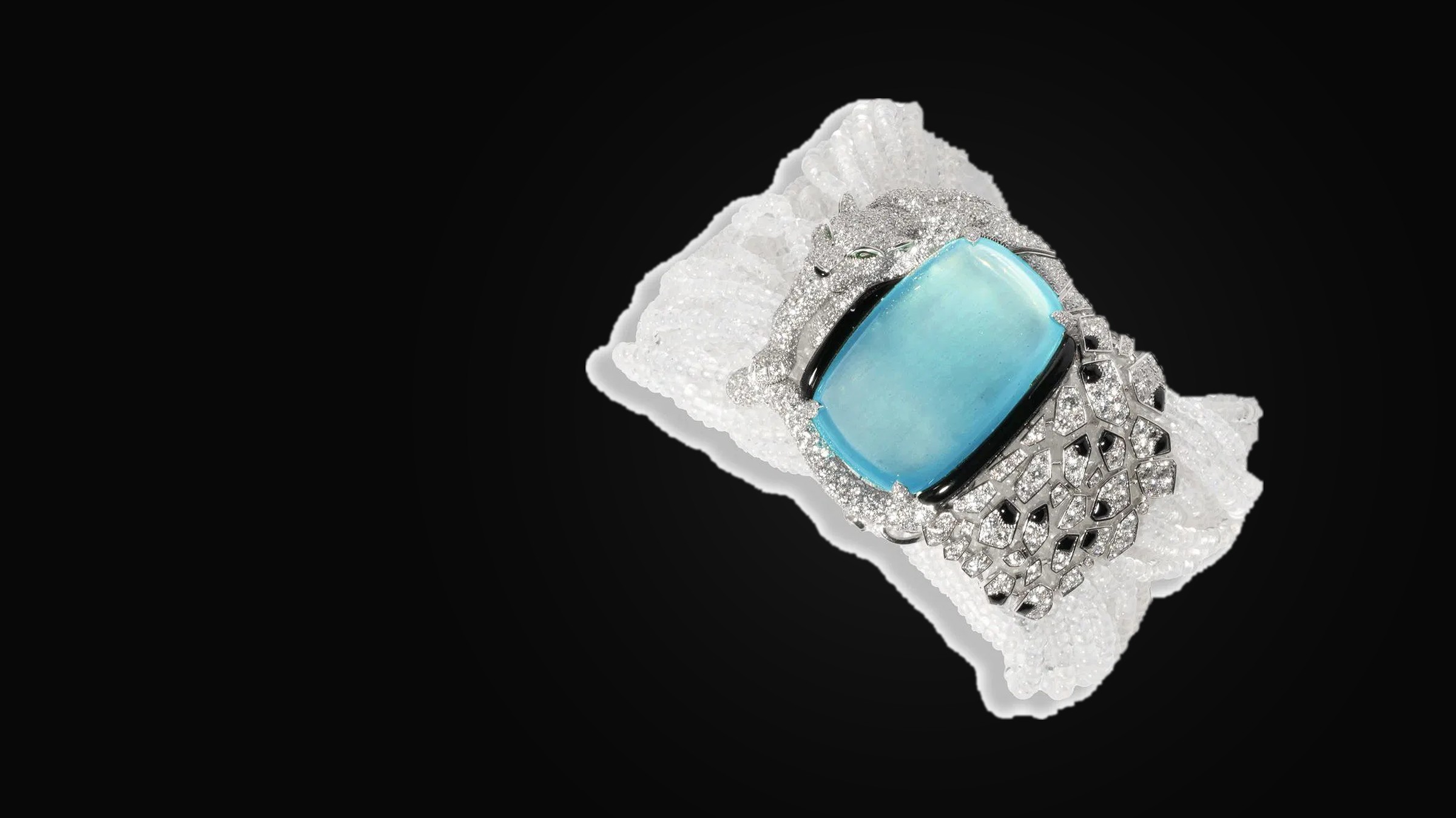 A Cartier 'Panthère de Cartier' bracelet set with an aquamarine, diamonds and multiple gemstones