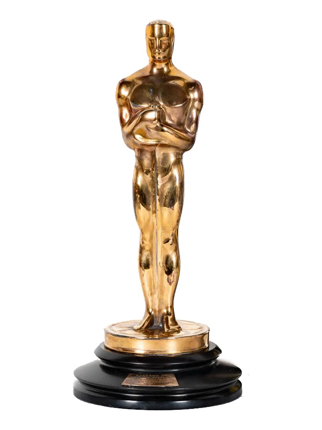 An Academy Award statuette on its black stepped base, the engraved plaque at the front
