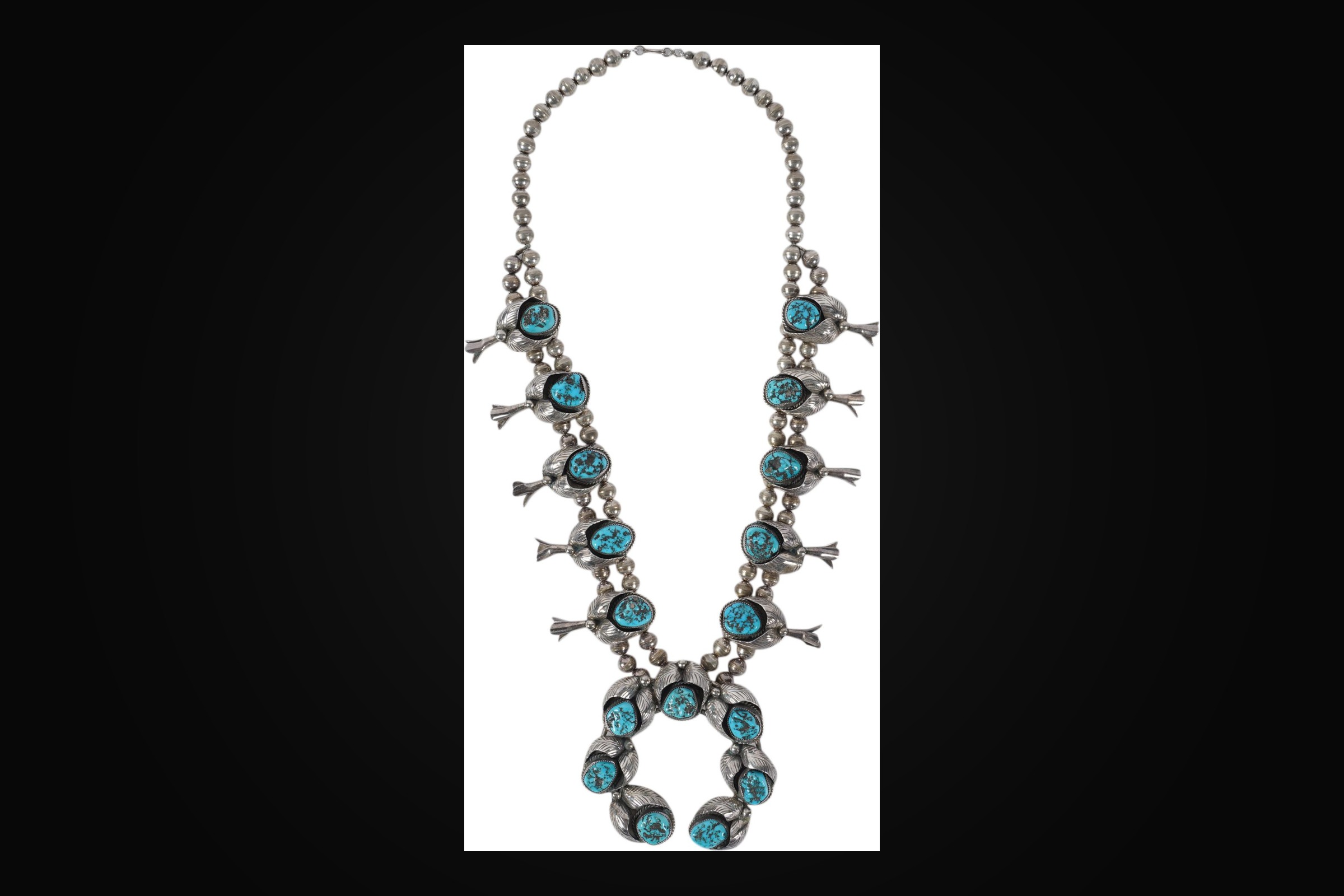A Navajo squash blossom necklace of turquoise and silver