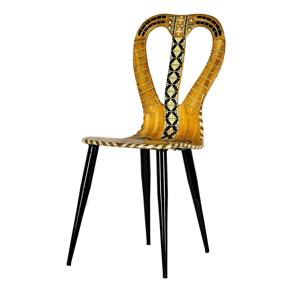 A decorated Italian side chair with a lyre back and black tapered legs