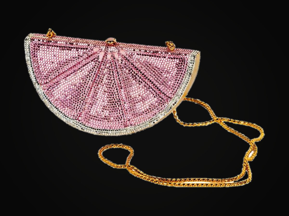 Judith Leiber — a pink crystal lemon-slice minaudière with a gold chain, from the Parkes wardrobe